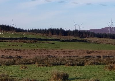 Barmark Hill looking North West from road to Barmark. The close proximity of several operational Blackcraig turbines (110m) to the proposed Garcrogo Windfarm is clearly evident.